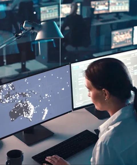 Woman tracking flight data on her computer